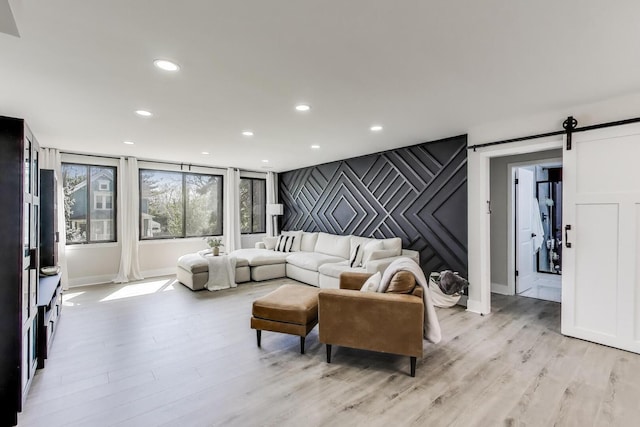 110 S Dunton Ave Unit 2C, Arlington Heights, IL 60005 - living room with a barn door, light wood-style flooring, recessed lighting, and baseboards