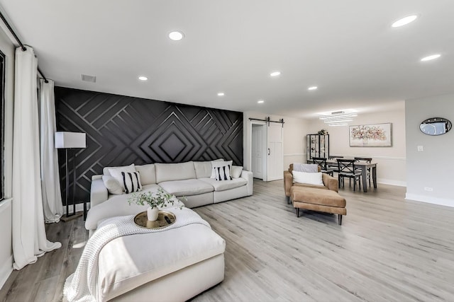 110 S Dunton Ave Unit 2C, Arlington Heights, IL 60005 - living room with a barn door, light wood-type flooring, baseboards, and recessed lighting