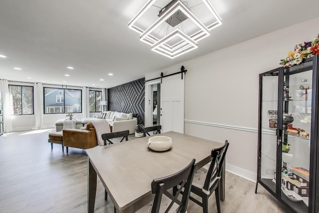 110 S Dunton Ave Unit 2C, Arlington Heights, IL 60005 - dining area with a barn door, light wood-style floors, recessed lighting, and baseboards
