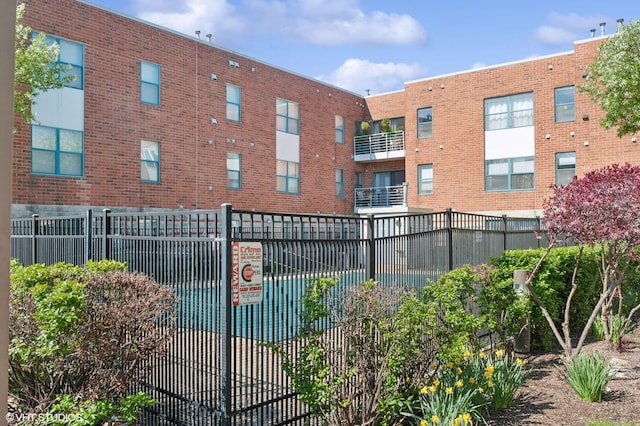 view of pool with fence