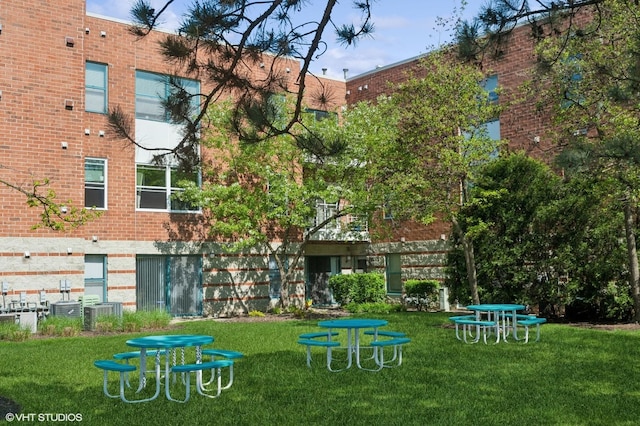 view of community featuring a lawn