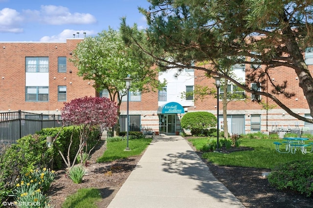 view of property's community featuring fence