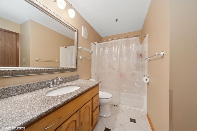 bathroom featuring tile patterned flooring, toilet, vanity, and shower / tub combo