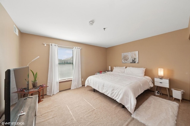 bedroom with light colored carpet
