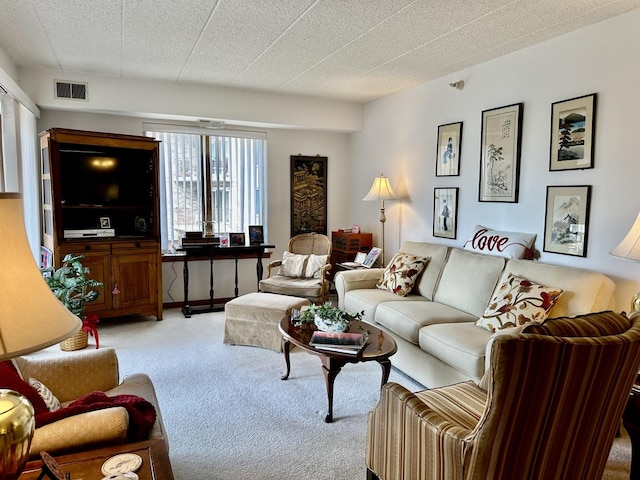 carpeted living room featuring visible vents