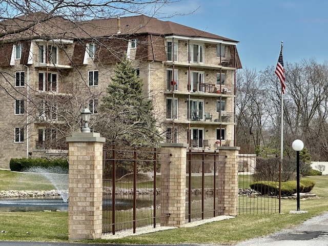 view of building exterior featuring fence