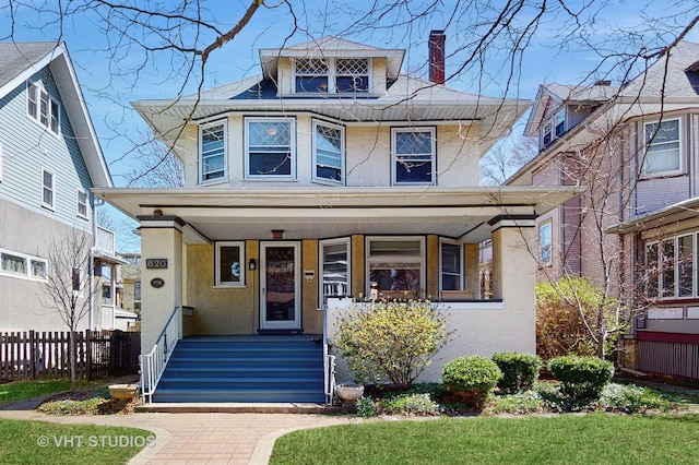 620 S Elmwood Ave, Oak Park, IL 60304 - american foursquare style home featuring a chimney, stucco siding, covered porch, and fence