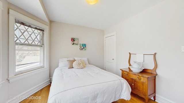 620 S Elmwood Ave, Oak Park, IL 60304 - bedroom featuring baseboards and wood finished floors