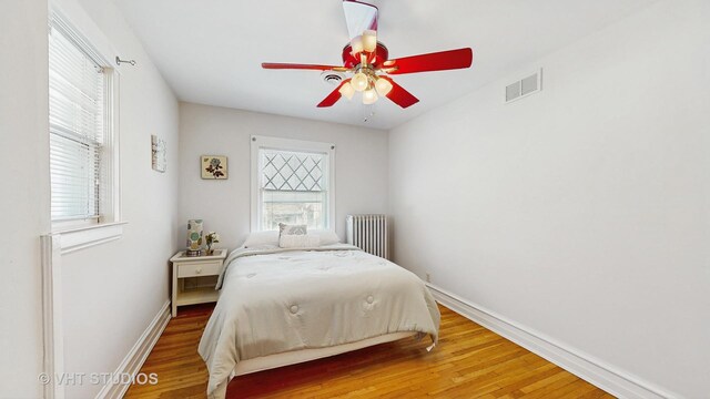 620 S Elmwood Ave, Oak Park, IL 60304 - bedroom with visible vents, wood finished floors, baseboards, and ceiling fan