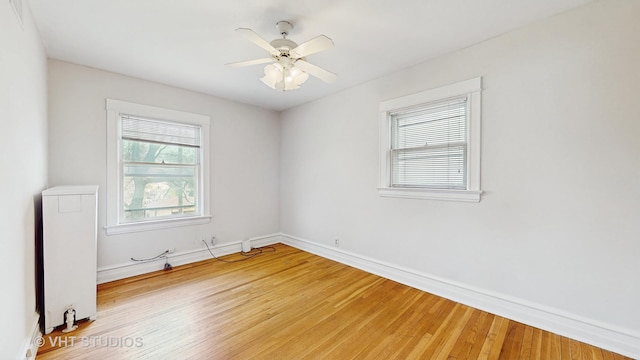 620 S Elmwood Ave, Oak Park, IL 60304 - empty room with light wood finished floors, baseboards, and ceiling fan