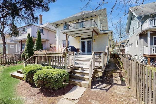 620 S Elmwood Ave, Oak Park, IL 60304 - back of house with fence private yard, stucco siding, a residential view, and a balcony