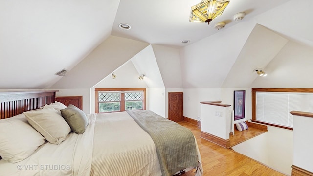 620 S Elmwood Ave, Oak Park, IL 60304 - bedroom featuring vaulted ceiling and light wood-style flooring