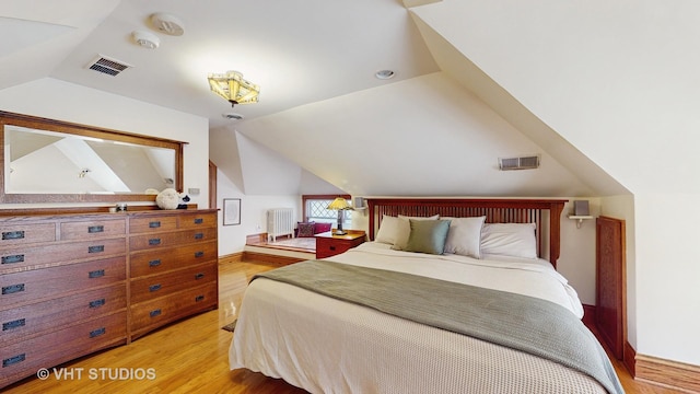 620 S Elmwood Ave, Oak Park, IL 60304 - bedroom with vaulted ceiling, visible vents, and light wood finished floors