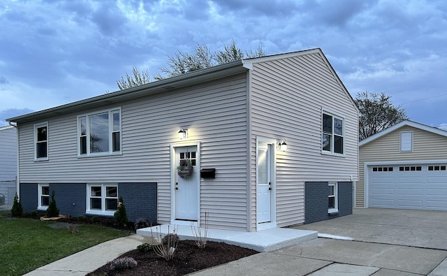 9055 Fairway Dr, Orland Park, IL 60462 - view of front of property with concrete driveway, an outbuilding, a front lawn, and a garage