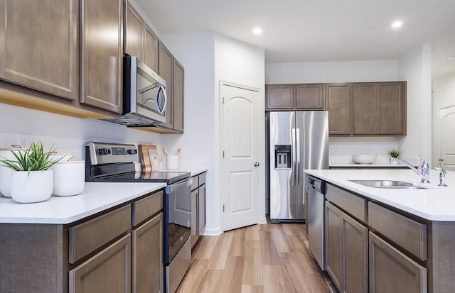 109 N Van Nortwick Ave, Batavia, IL 60510 - kitchen with appliances with stainless steel finishes, a sink, light wood finished floors, recessed lighting, and light countertops