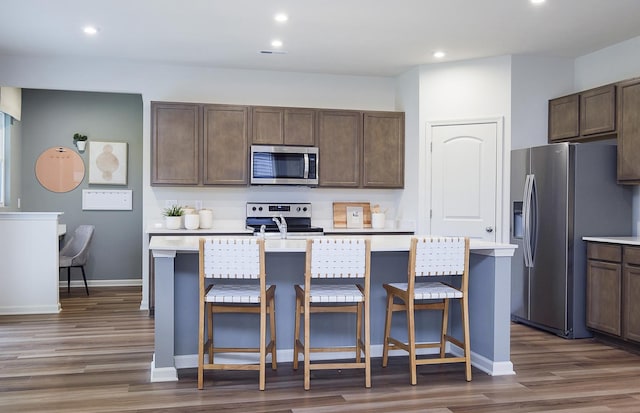 109 N Van Nortwick Ave, Batavia, IL 60510 - kitchen with stainless steel appliances, light countertops, dark brown cabinets, and recessed lighting