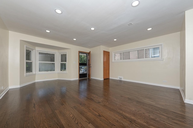 8007 S Houston Ave, Chicago, IL 60617 - unfurnished living room featuring recessed lighting, dark wood finished floors, and baseboards