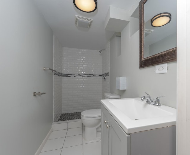 8007 S Houston Ave, Chicago, IL 60617 - bathroom featuring tiled shower, tile patterned flooring, toilet, and vanity