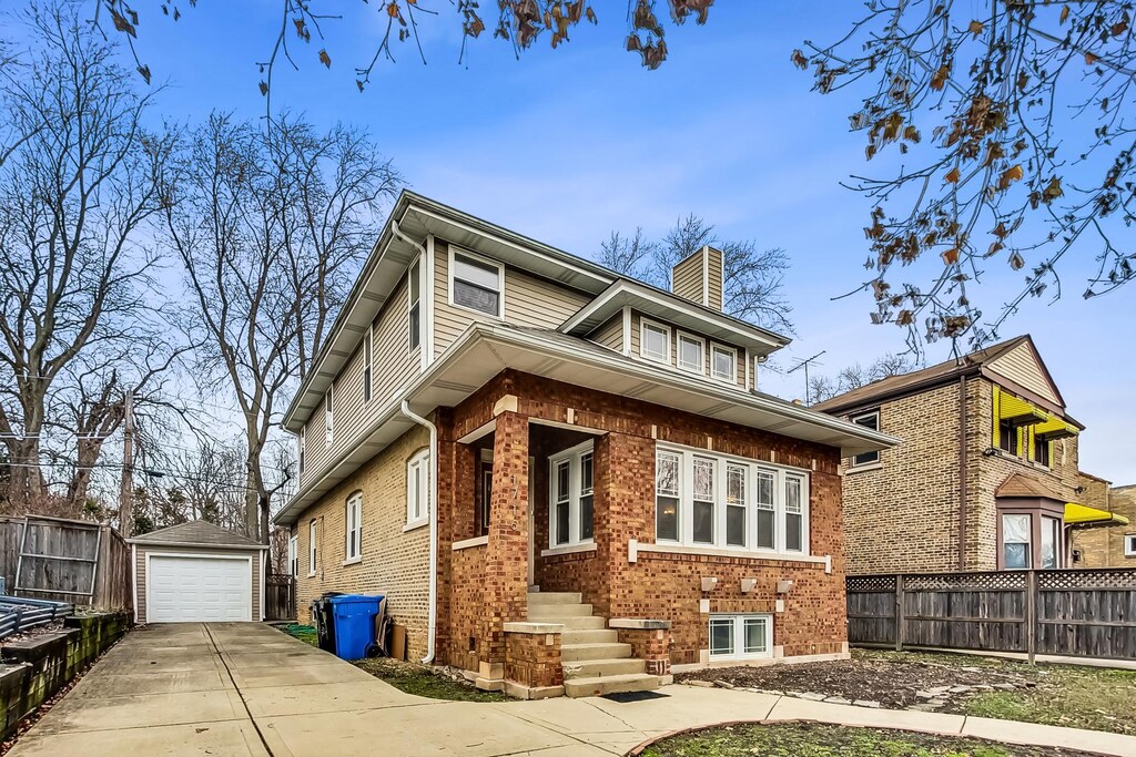 1716 W Beverly Glen Pkwy, Chicago, IL 60643 - view of front of house featuring a chimney, a detached garage, an outbuilding, fence, and brick siding