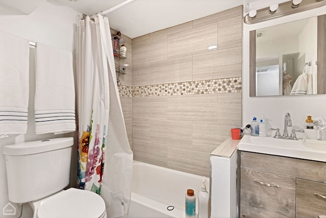 bathroom with shower / bath combination with curtain, toilet, and vanity