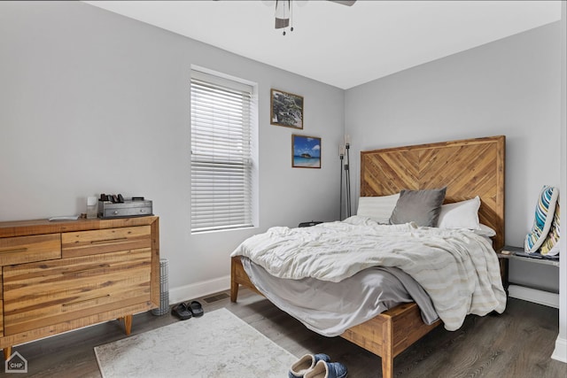 bedroom featuring a ceiling fan, wood finished floors, and baseboards