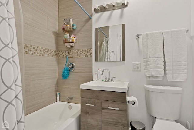 bathroom with vanity, shower / bath combo, and toilet