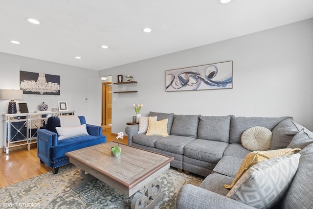 living area featuring light wood-style flooring and recessed lighting