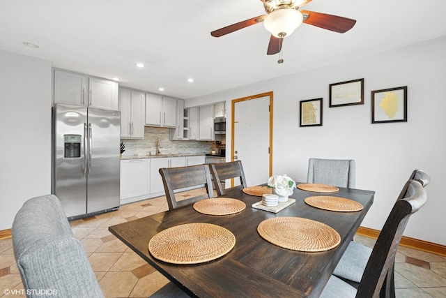 dining room with ceiling fan, recessed lighting, baseboards, and light tile patterned floors
