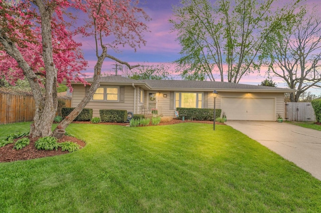 ranch-style home with concrete driveway and a garage