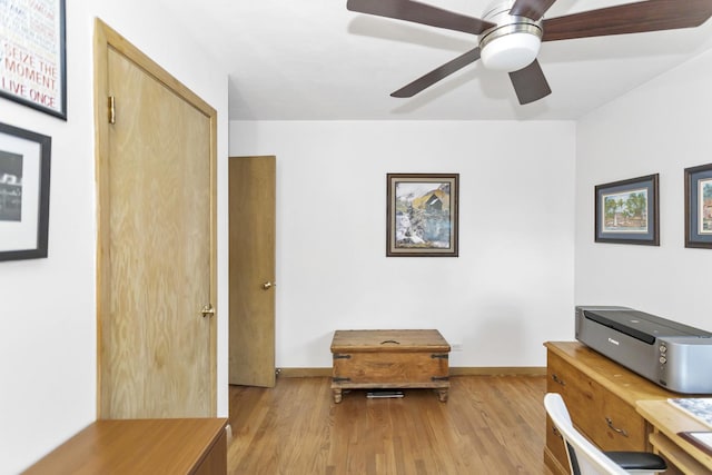 office with light wood-type flooring, baseboards, and ceiling fan