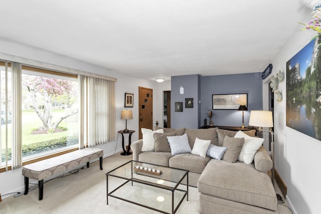 carpeted living room with baseboards