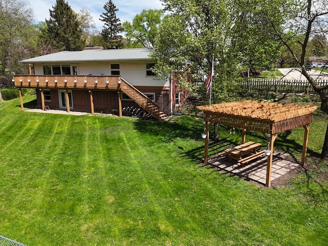 1612 Parkside Ct, Freeport, IL 61032 - rear view of property with a wooden deck, a patio, a lawn, and stairway