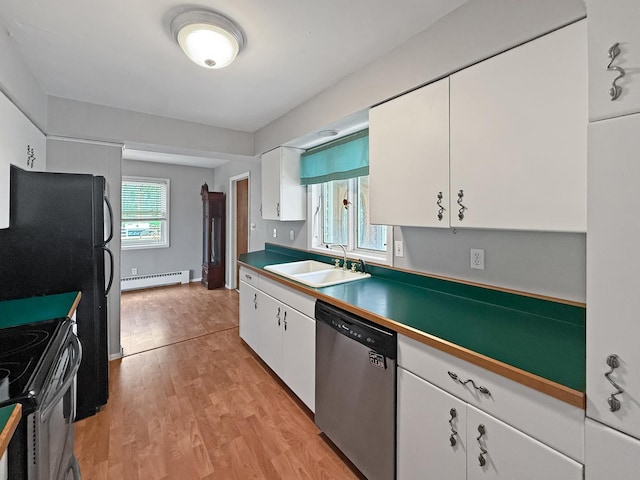 1612 Parkside Ct, Freeport, IL 61032 - kitchen with stainless steel dishwasher, a sink, a baseboard radiator, electric stove, and white cabinets