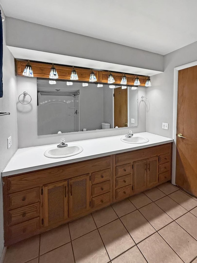 1612 Parkside Ct, Freeport, IL 61032 - bathroom with tile patterned floors, double vanity, and toilet