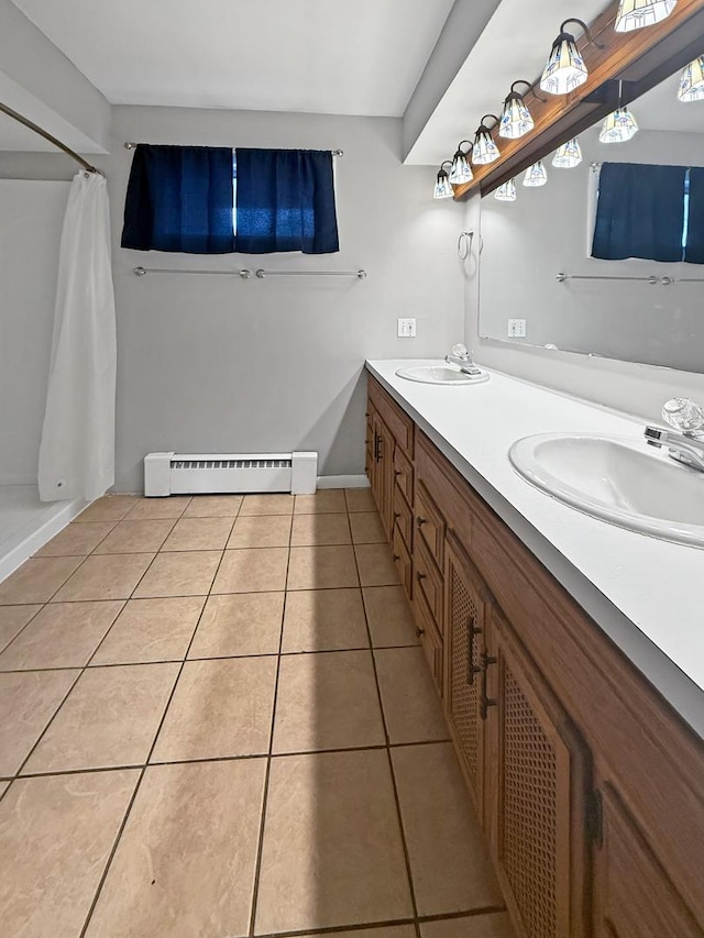 1612 Parkside Ct, Freeport, IL 61032 - bathroom featuring a baseboard heating unit, tile patterned floors, double vanity, a shower with curtain, and baseboards