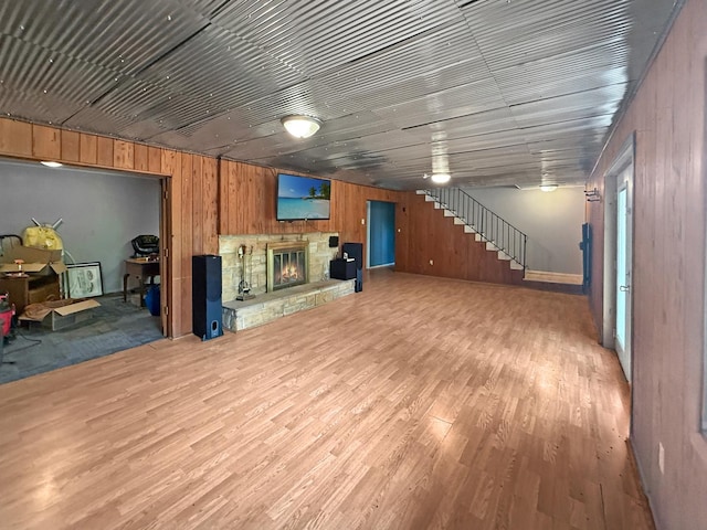 1612 Parkside Ct, Freeport, IL 61032 - basement with wooden walls, wood finished floors, a stone fireplace, and stairs