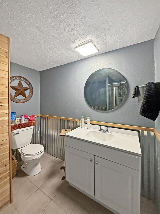 1612 Parkside Ct, Freeport, IL 61032 - bathroom featuring toilet, a textured ceiling, tile patterned flooring, and vanity