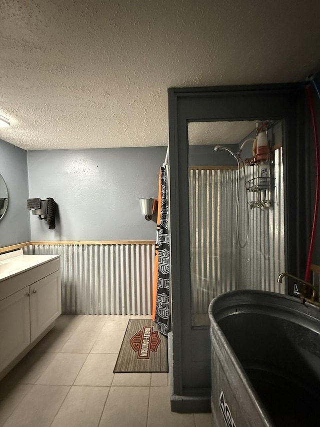1612 Parkside Ct, Freeport, IL 61032 - bathroom featuring vanity, tile patterned floors, a textured ceiling, and a shower