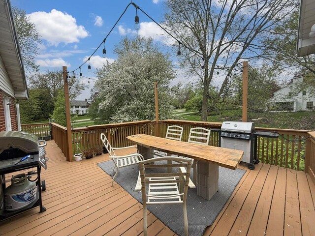 1612 Parkside Ct, Freeport, IL 61032 - wooden deck with grilling area and outdoor dining space