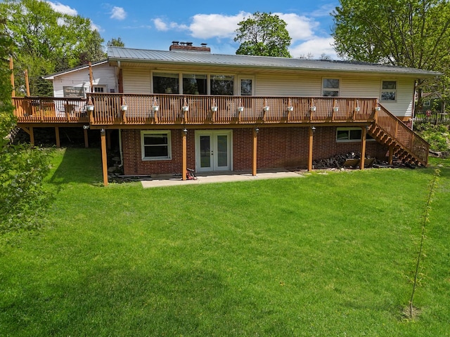 1612 Parkside Ct, Freeport, IL 61032 - back of house featuring french doors, a wooden deck, and a yard