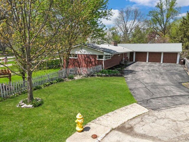 1612 Parkside Ct, Freeport, IL 61032 - ranch-style home featuring a chimney and brick siding