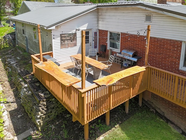 1612 Parkside Ct, Freeport, IL 61032 - wooden terrace with outdoor dining space and area for grilling