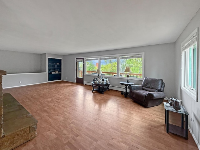 1612 Parkside Ct, Freeport, IL 61032 - living area featuring a baseboard radiator, wood finished floors, and baseboards