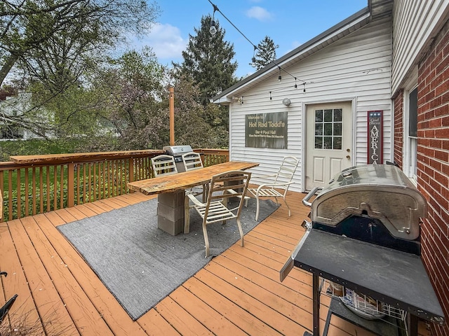 1612 Parkside Ct, Freeport, IL 61032 - wooden terrace with outdoor dining area and grilling area