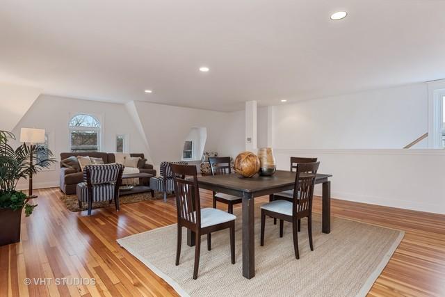dining room featuring light wood finished floors, baseboards, and recessed lighting