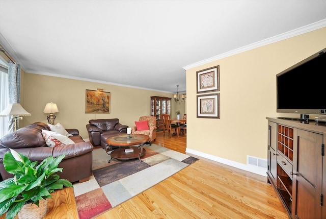 7513 Rohrer Dr, Downers Grove, IL 60516 - living area featuring a chandelier, light wood-style flooring, a healthy amount of sunlight, and ornamental molding