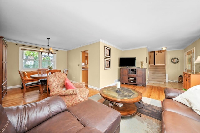 7513 Rohrer Dr, Downers Grove, IL 60516 - living room with stairs, light wood-type flooring, an inviting chandelier, crown molding, and baseboards