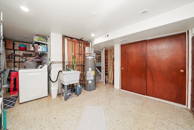 7513 Rohrer Dr, Downers Grove, IL 60516 - below grade area with washing machine and dryer, recessed lighting, visible vents, gas water heater, and tile patterned floors