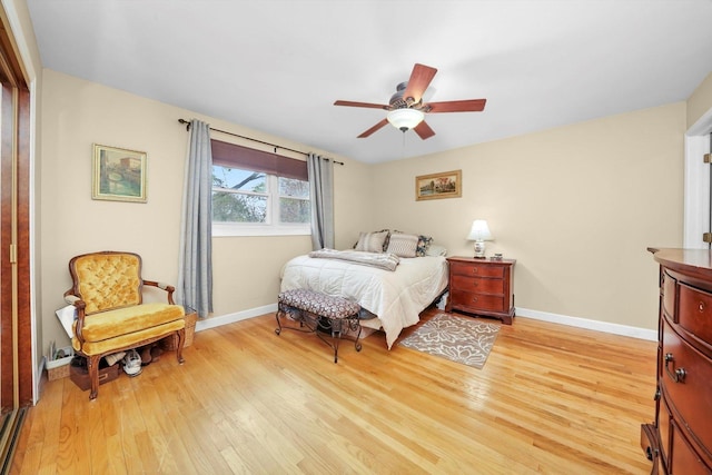 7513 Rohrer Dr, Downers Grove, IL 60516 - bedroom with baseboards, light wood finished floors, and a ceiling fan