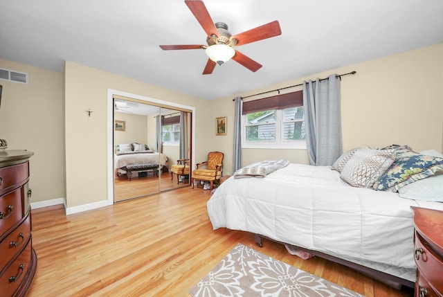 7513 Rohrer Dr, Downers Grove, IL 60516 - bedroom with light wood finished floors, a ceiling fan, a closet, visible vents, and baseboards